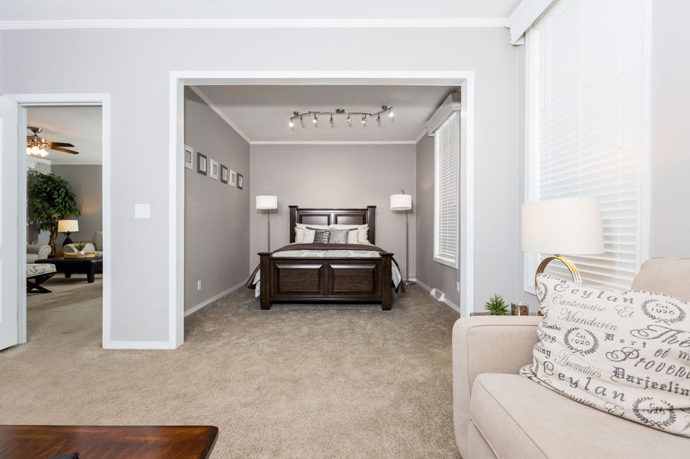 The ENCHANTMENT 3070A Primary Bedroom. This Manufactured Mobile Home features 3 bedrooms and 2 baths.