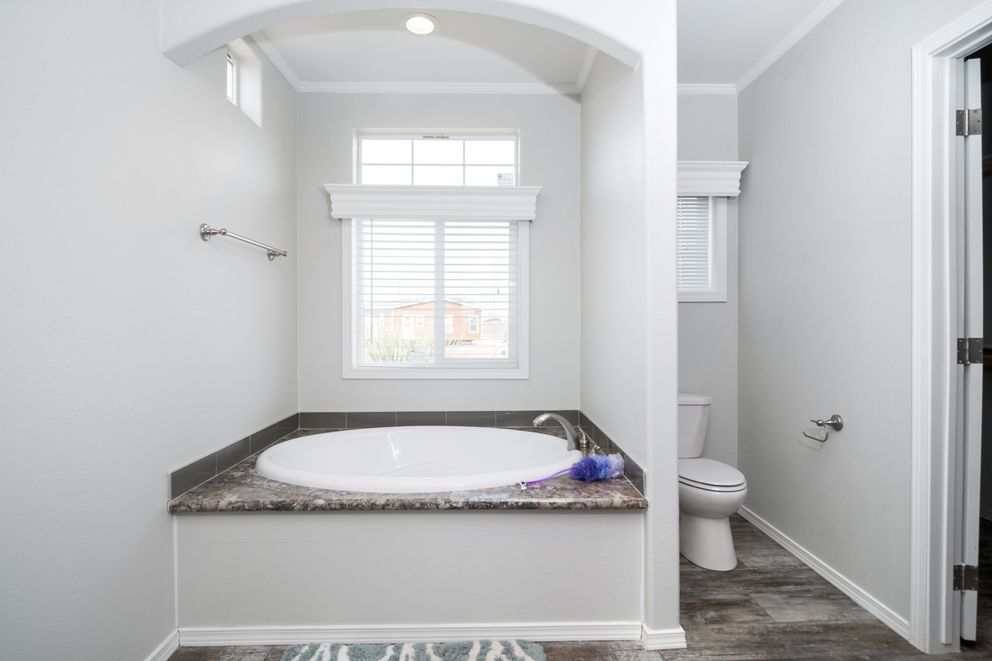 The ENCHANTMENT 3070A Primary Bathroom. This Manufactured Mobile Home features 3 bedrooms and 2 baths.