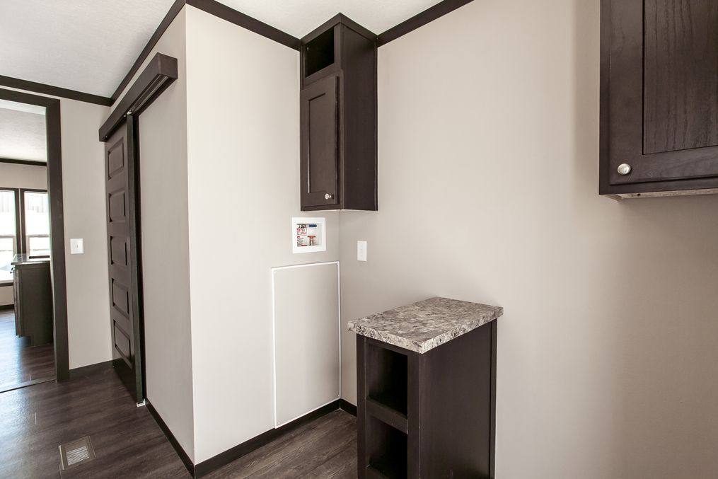 The THE FRANKLIN Utility Room. This Manufactured Mobile Home features 3 bedrooms and 2 baths.