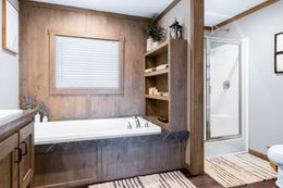 The FARMHOUSE 3 Primary Bathroom. This Manufactured Mobile Home features 3 bedrooms and 2 baths.