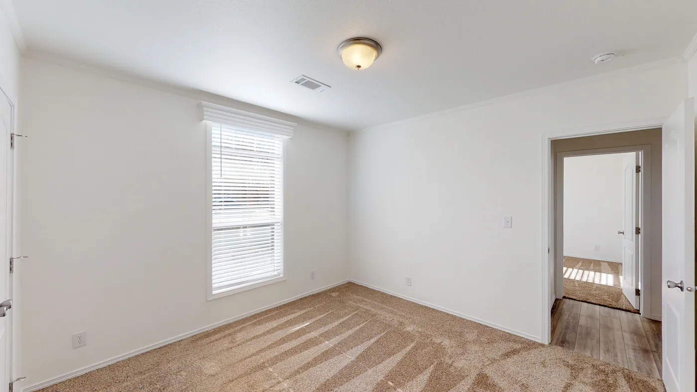 The SUM3068A Bedroom. This Manufactured Mobile Home features 3 bedrooms and 2 baths.