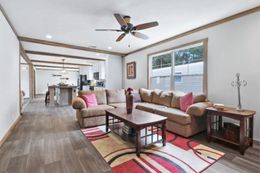The NELLIE Family Room. This Manufactured Mobile Home features 4 bedrooms and 2 baths.