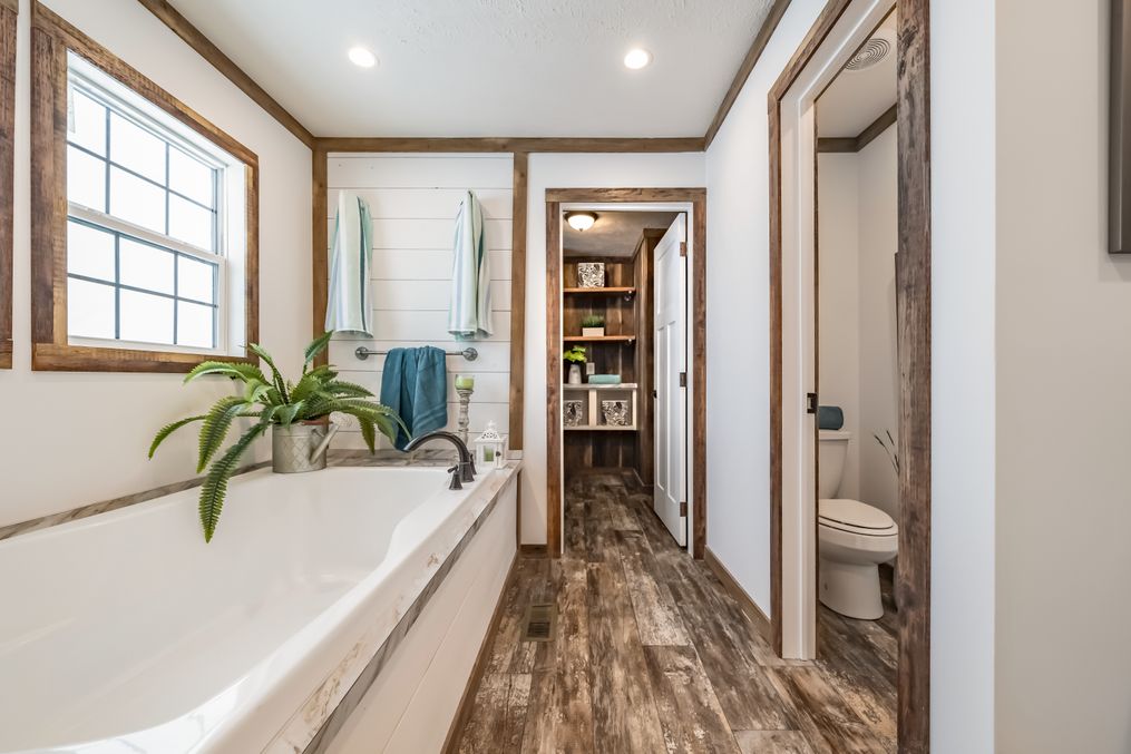 The THE EMMA JEAN Master Bathroom. This Manufactured Mobile Home features 4 bedrooms and 3 baths.