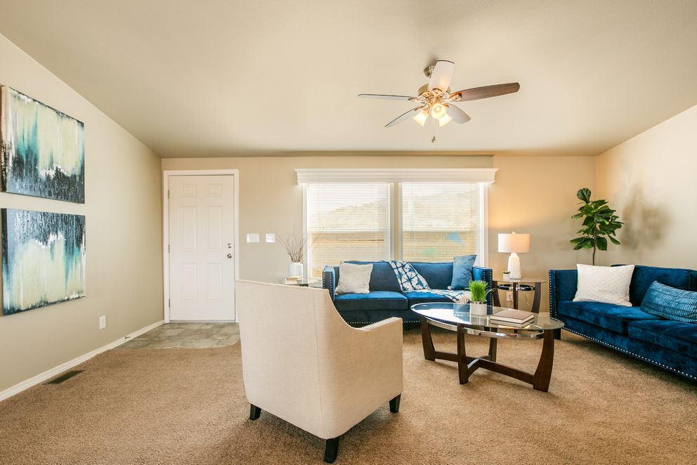 The THE WAVE Family Room. This Manufactured Mobile Home features 4 bedrooms and 2 baths.