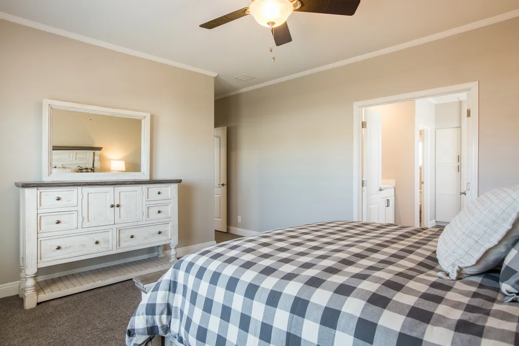 The EDGEWOOD Primary Bedroom. This Manufactured Mobile Home features 3 bedrooms and 2 baths.