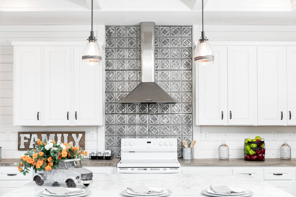 The 1440 CAROLINA 4BR BELLE Kitchen. This Manufactured Mobile Home features 4 bedrooms and 2 baths.