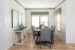 The THE HAMPTON BAY Dining Area. This Manufactured Mobile Home features 3 bedrooms and 2 baths.