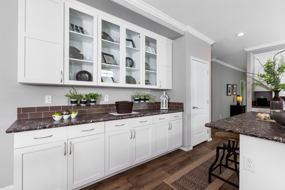 The ENCHANTMENT 3070A Kitchen. This Manufactured Mobile Home features 3 bedrooms and 2 baths.