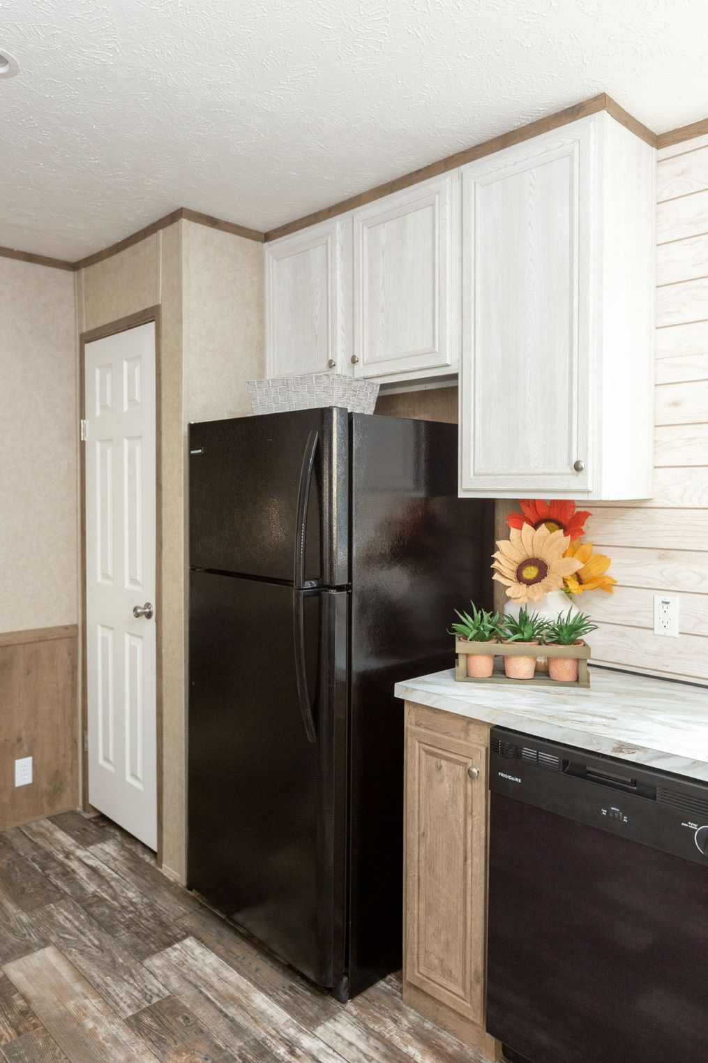 The THE RANCH HOUSE Kitchen. This Manufactured Mobile Home features 3 bedrooms and 2 baths.