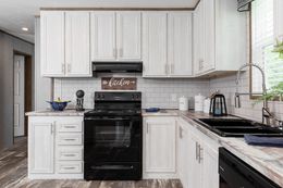 The THE MORRIS Kitchen. This Manufactured Mobile Home features 3 bedrooms and 2 baths.
