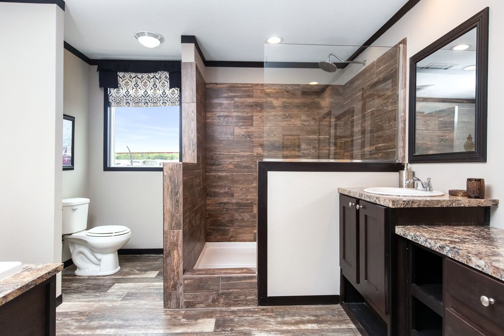 The THE WASHINGTON Primary Bathroom. This Manufactured Mobile Home features 3 bedrooms and 2 baths.