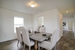 The CERISE Dining Room. This Manufactured Mobile Home features 4 bedrooms and 2 baths.