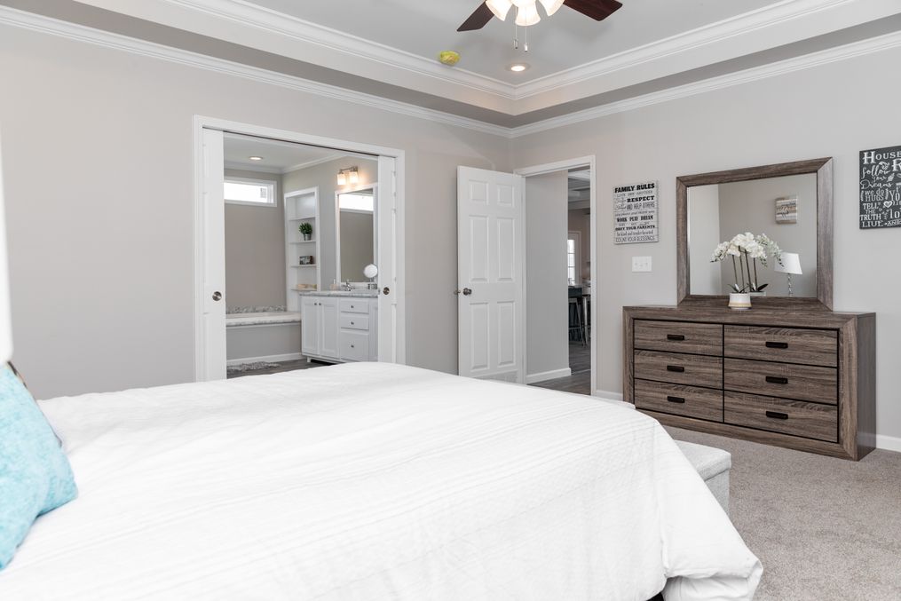 The THE SUPER 68 Master Bedroom. This Manufactured Mobile Home features 3 bedrooms and 2 baths.