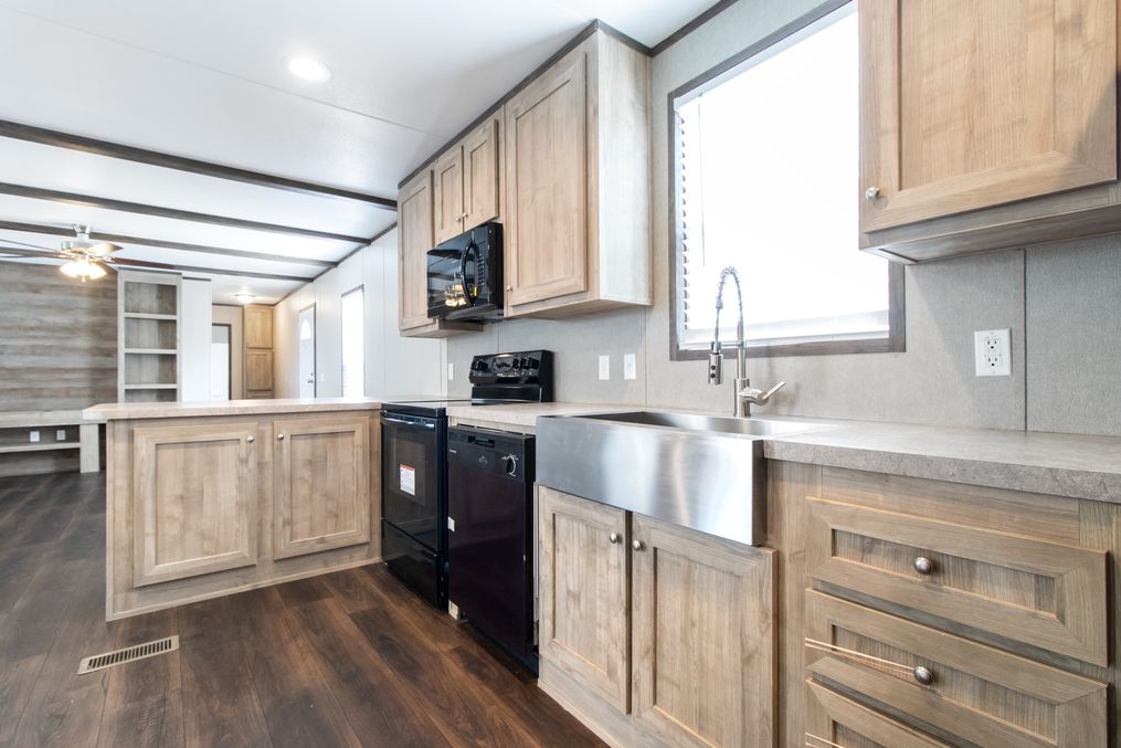 The ANNIVERSARY 16682A Kitchen. This Manufactured Mobile Home features 2 bedrooms and 2 baths.