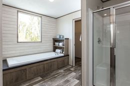 The THE BREEZE II Primary Bathroom. This Manufactured Mobile Home features 4 bedrooms and 2 baths.