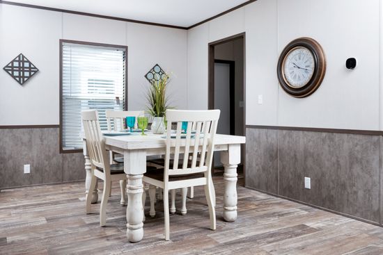 The CRAZY EIGHTS Dining Room. This Manufactured Mobile Home features 4 bedrooms and 2 baths.