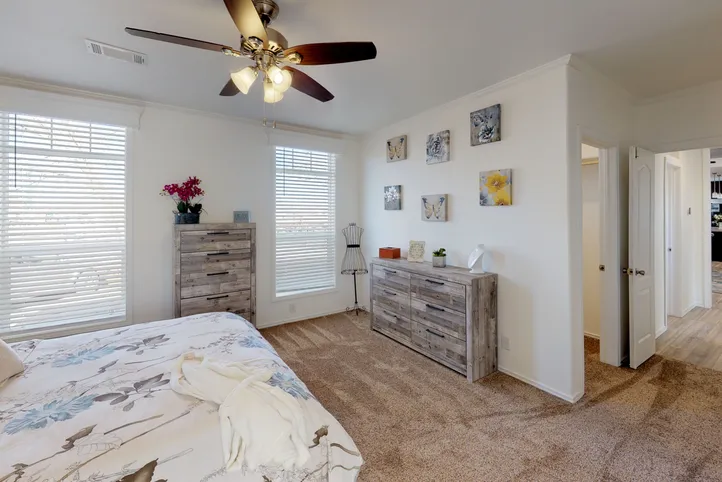 The SUM3068A Primary Bedroom. This Manufactured Mobile Home features 3 bedrooms and 2 baths.