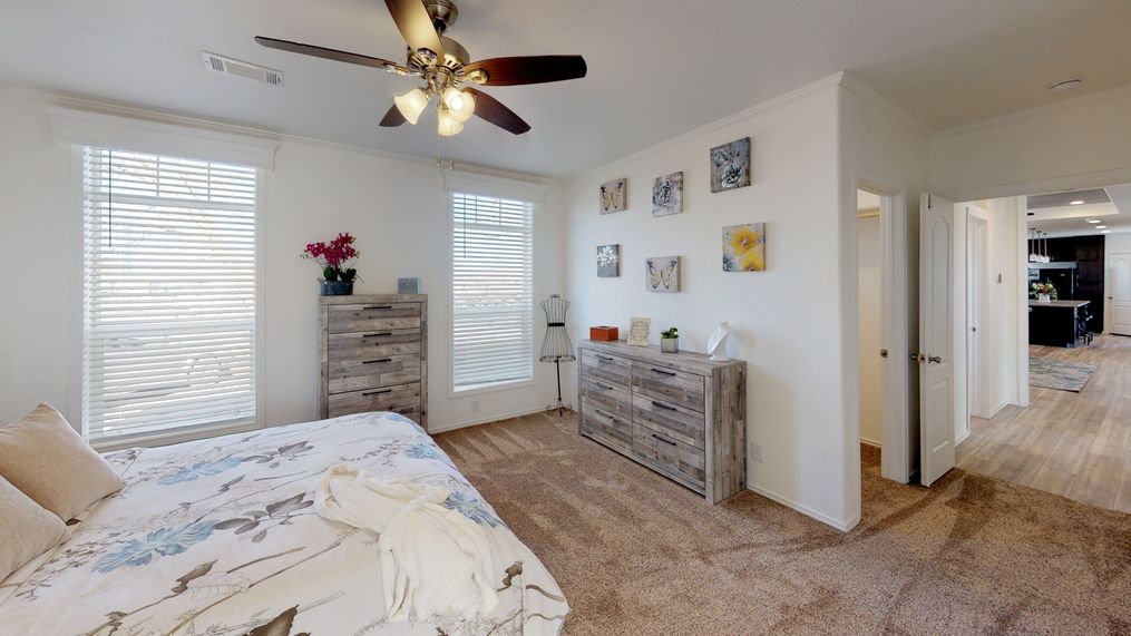 The SUM3068A Master Bedroom. This Manufactured Mobile Home features 3 bedrooms and 2 baths.
