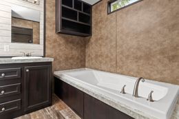The THE ANNIVERSARY ISLANDER Master Bathroom. This Manufactured Mobile Home features 3 bedrooms and 2 baths.