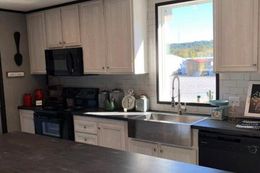 The THE MEADOWBROOK Kitchen. This Manufactured Mobile Home features 4 bedrooms and 2 baths.