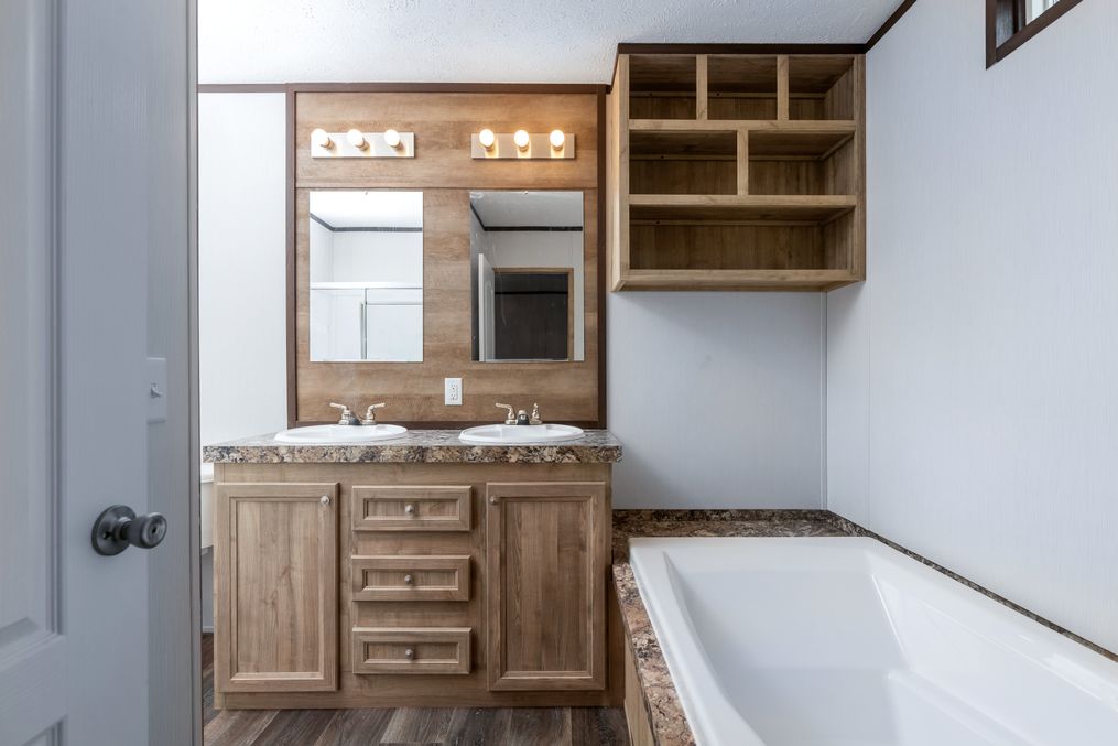 The THE ANNIVERSARY 16 Master Bathroom. This Manufactured Mobile Home features 3 bedrooms and 2 baths.