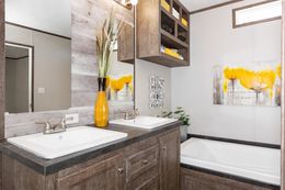 The THE ANNIVERSARY 76 Master Bathroom. This Manufactured Mobile Home features 3 bedrooms and 2 baths.