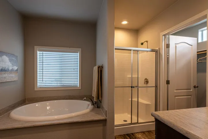 The K1676H Primary Bathroom. This Manufactured Mobile Home features 3 bedrooms and 2 baths.
