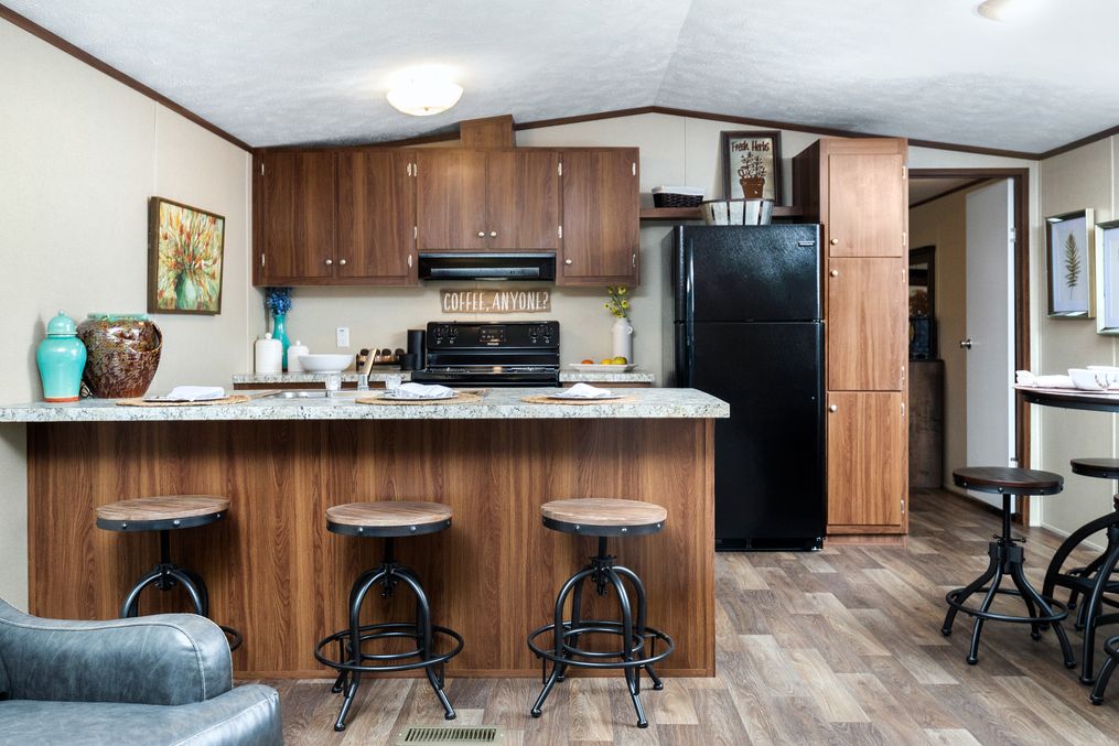 The VICTORY PLUS Kitchen. This Manufactured Mobile Home features 3 bedrooms and 2 baths.