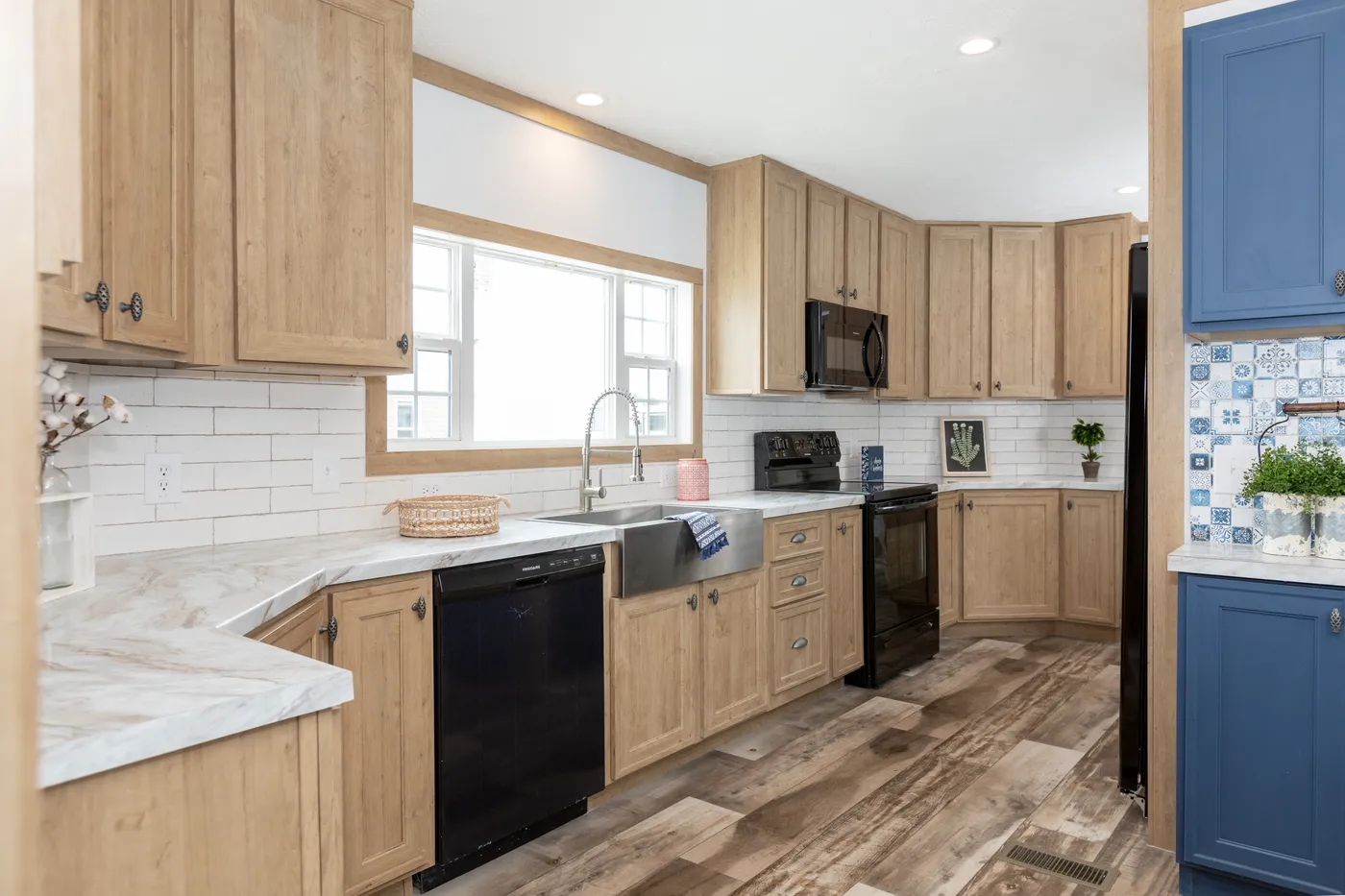 The THE BEXAR Kitchen. This Manufactured Mobile Home features 3 bedrooms and 2 baths.