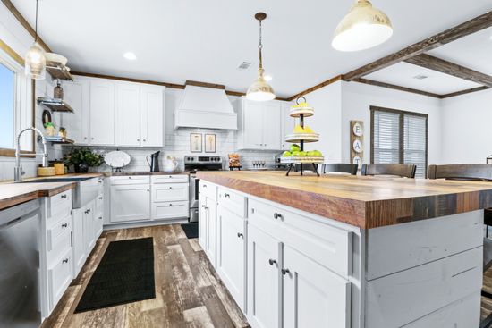 The THE DIXIE-MAE Kitchen. This Manufactured Mobile Home features 4 bedrooms and 3 baths.