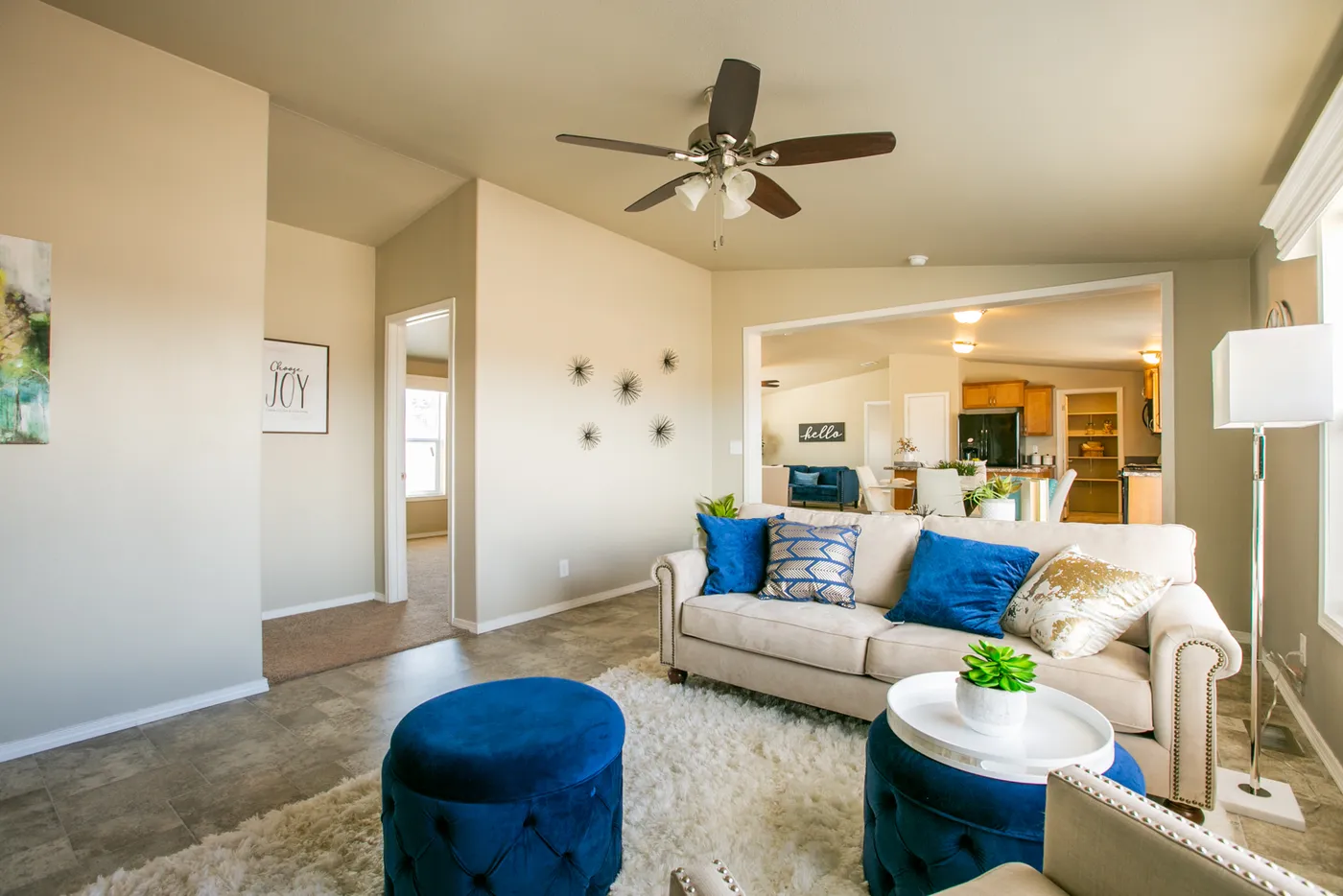 The THE WAVE Living Room. This Manufactured Mobile Home features 4 bedrooms and 2 baths.