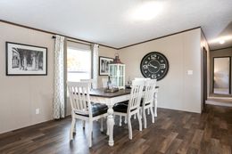 The TRIUMPH Dining Room. This Manufactured Mobile Home features 5 bedrooms and 3 baths.