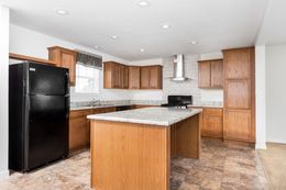 The BEVERLY PARK 6028-MS027 SECT Kitchen. This Manufactured Mobile Home features 4 bedrooms and 2 baths.
