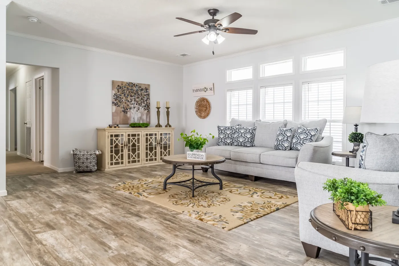 The THE INGRAM Living Room. This Manufactured Mobile Home features 3 bedrooms and 2 baths.