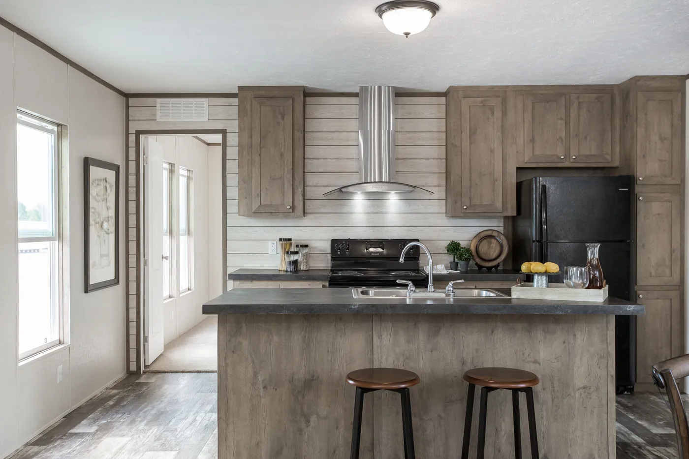 The THE BREEZE Kitchen. This Manufactured Mobile Home features 3 bedrooms and 2 baths.