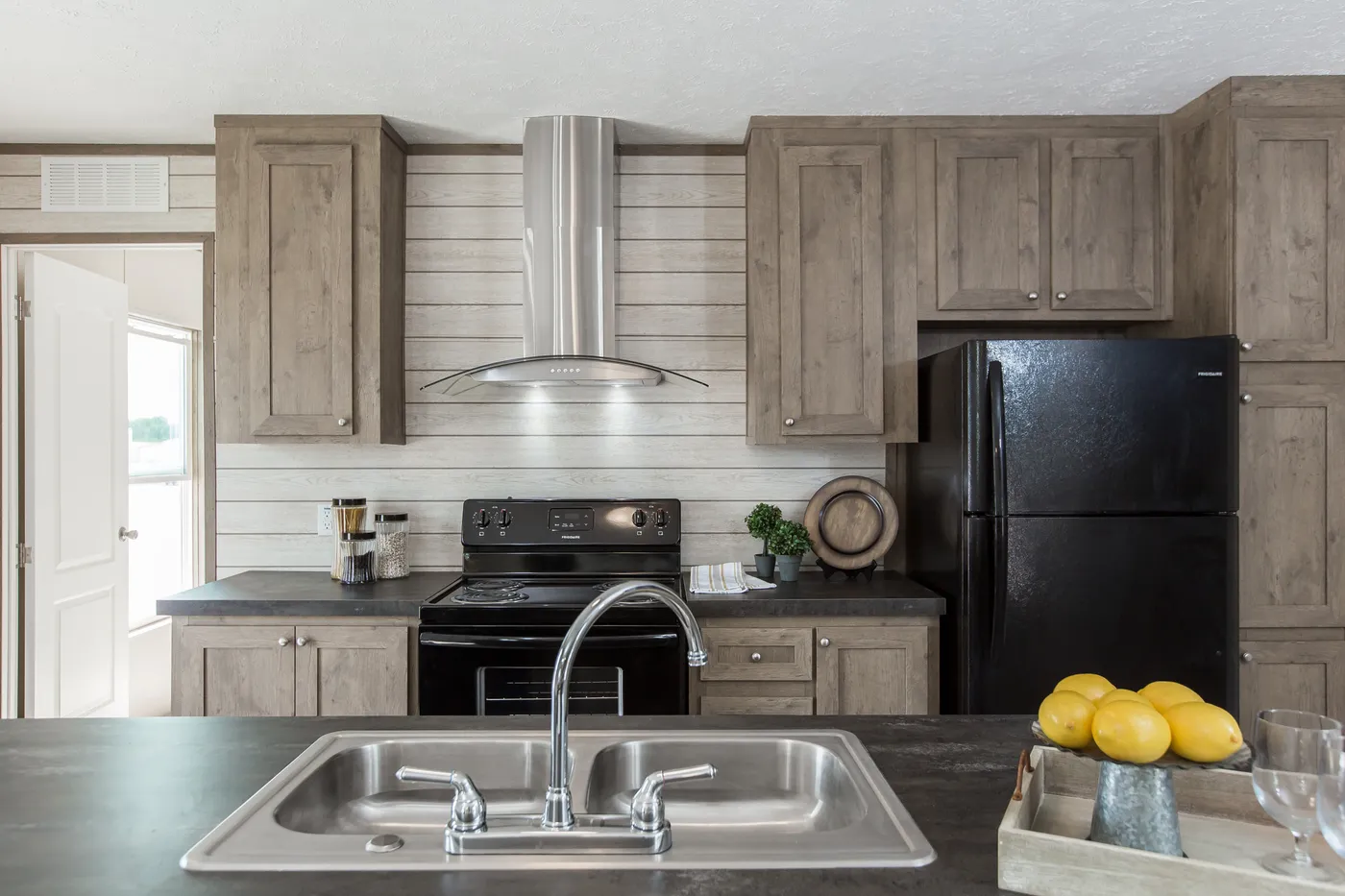 The THE BREEZE Kitchen. This Manufactured Mobile Home features 3 bedrooms and 2 baths.