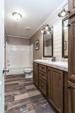The BLACKJACK 32' Guest Bathroom. This Manufactured Mobile Home features 4 bedrooms and 2 baths.