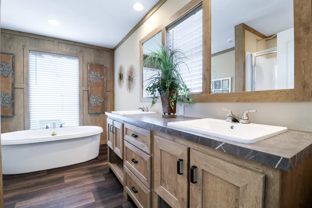 The AIMEE Primary Bathroom. This Manufactured Mobile Home features 3 bedrooms and 2 baths.
