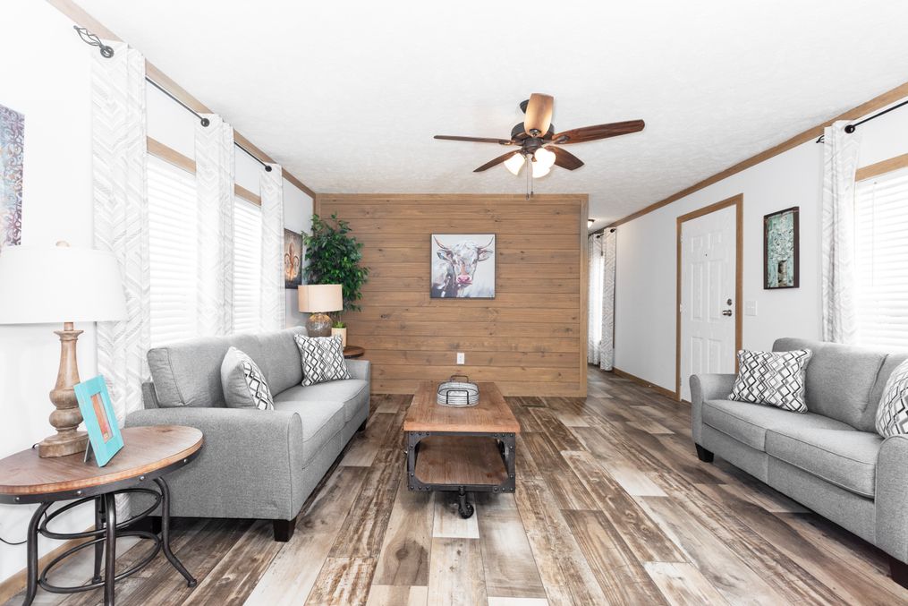 The THE BEXAR Living Room. This Manufactured Mobile Home features 3 bedrooms and 2 baths.
