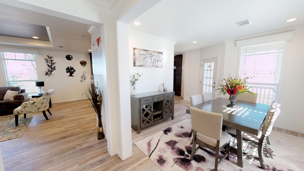 The SUM3068A Dining Area. This Manufactured Mobile Home features 3 bedrooms and 2 baths.