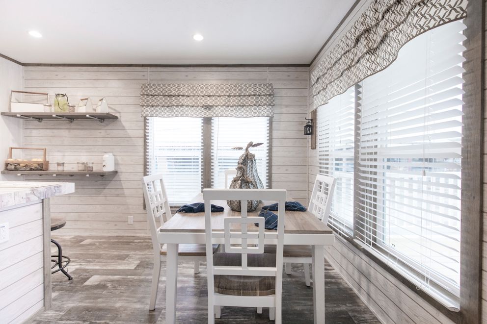 The THE SOUTHERN FARMHOUSE Dining Area. This Manufactured Mobile Home features 3 bedrooms and 2 baths.