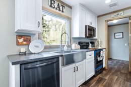 The COUNTRY COTTAGE Kitchen. This Manufactured Mobile Home features 3 bedrooms and 2 baths.