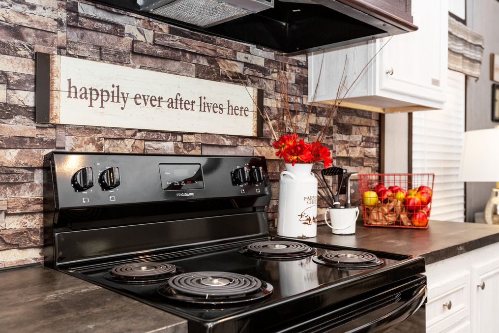 The THE GRANITE RIDGE Kitchen. This Manufactured Mobile Home features 3 bedrooms and 2 baths.