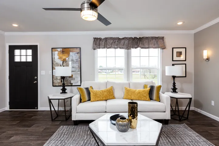 The THE FREEDOM SOHO Living Room. This Manufactured Mobile Home features 3 bedrooms and 2 baths.