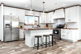 The THE BRAZOS Kitchen. This Manufactured Mobile Home features 3 bedrooms and 2.5 baths.