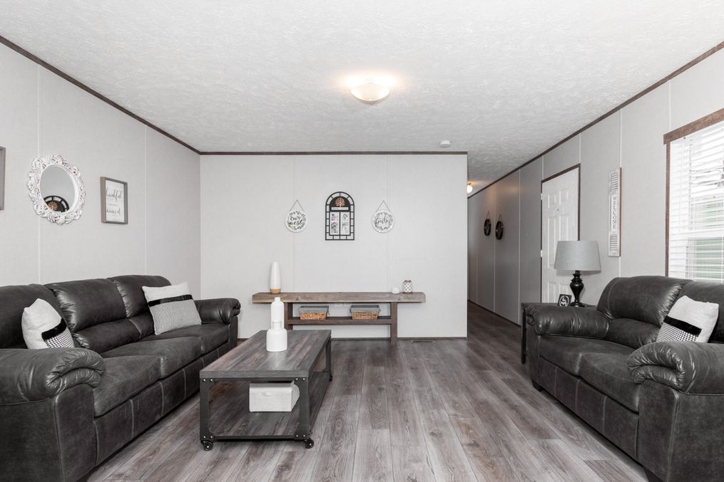 The BLAZER 76 P Living Room. This Manufactured Mobile Home features 3 bedrooms and 2 baths.