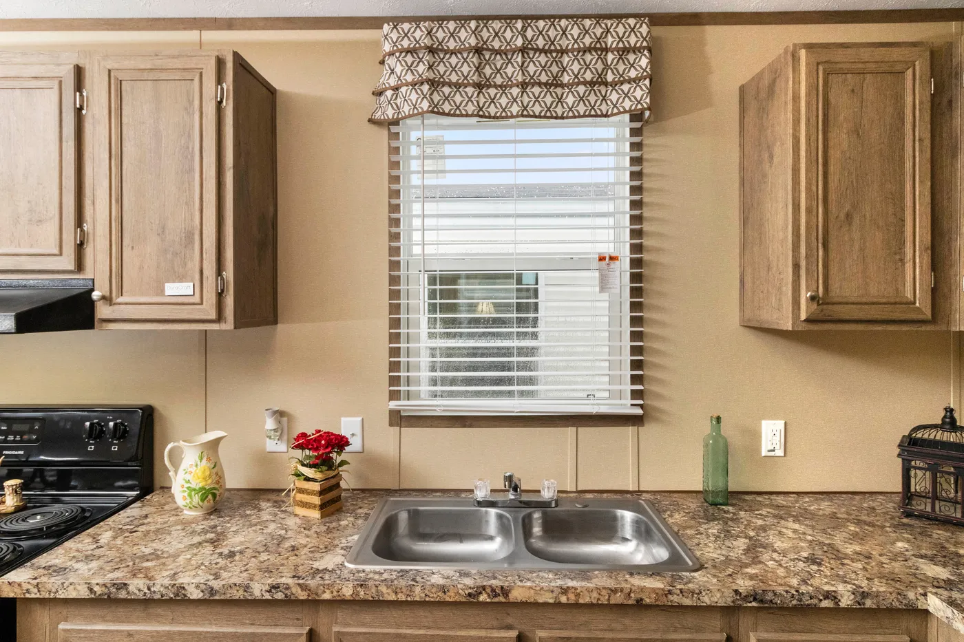 The THE HANCOCK Kitchen. This Manufactured Mobile Home features 2 bedrooms and 2 baths.