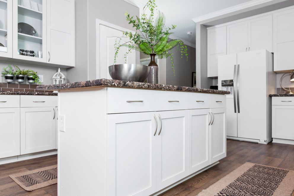 The ENCHANTMENT 3070A Kitchen. This Manufactured Mobile Home features 3 bedrooms and 2 baths.