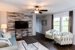 The FRONTIER Living Room. This Manufactured Mobile Home features 2 bedrooms and 2 baths.