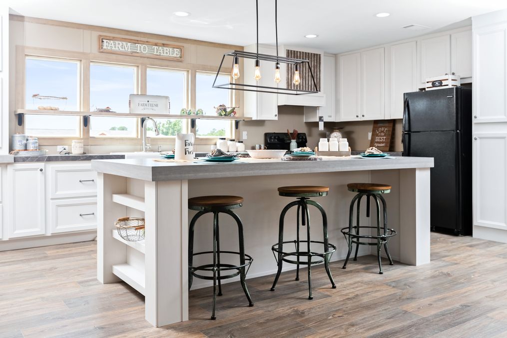 The FARMHOUSE FLEX Kitchen. This Manufactured Mobile Home features 3 bedrooms and 2.5 baths.